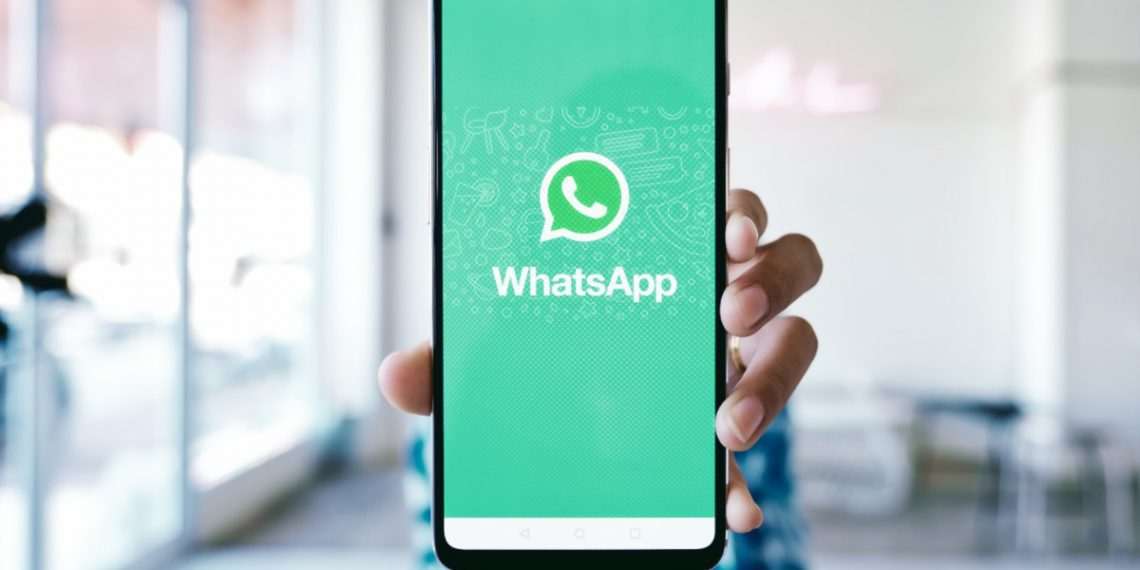 CHIANG MAI, THAILAND - Dec 1, 2019 : Woman holding a Oneplus 6 and open appstore searching social Internet service WhatsApp on the screen.